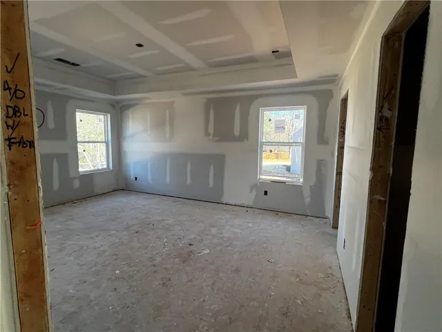 a view of empty room with windows