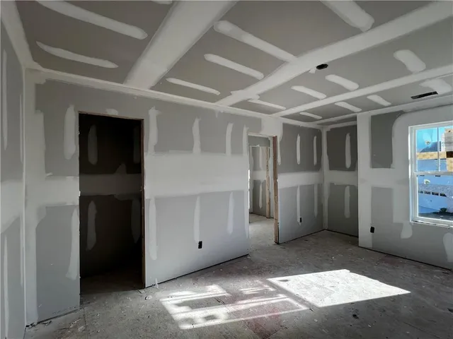 a view of a hallway with wooden shelves