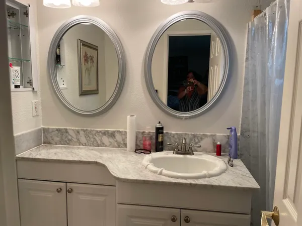 a bathroom with a sink and a mirror