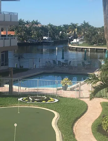 a view of a swimming pool with a lake view