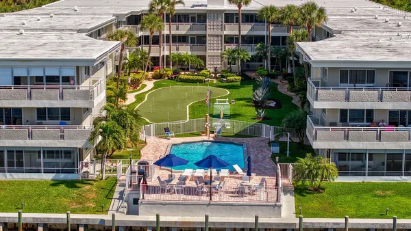 a view of pool with outdoor seating