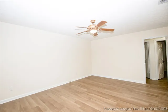 a bathroom with a granite countertop sink toilet a mirror a vanity and shower