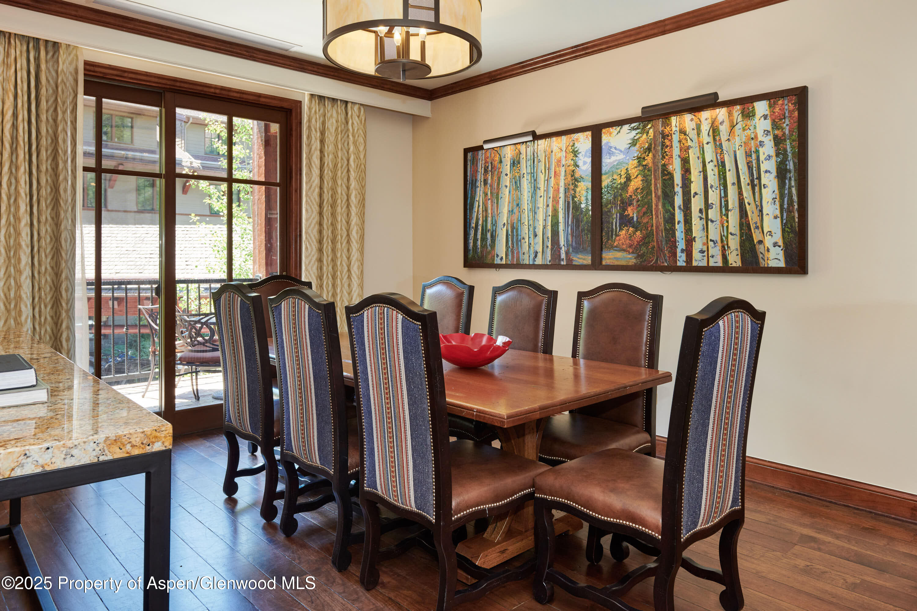 75 Prospector Road, Unit 82154 Aspen, CO 81611 - Photo 5 of 15 a view of a dining room with furniture window and wooden floor