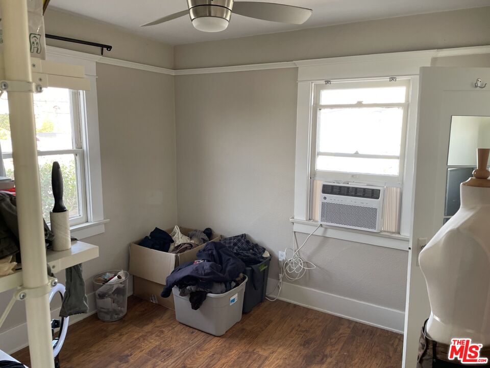 1920 South Rimpau Boulevard Los Angeles, CA 90016 - Photo 12 of 25 a living room with furniture and a window