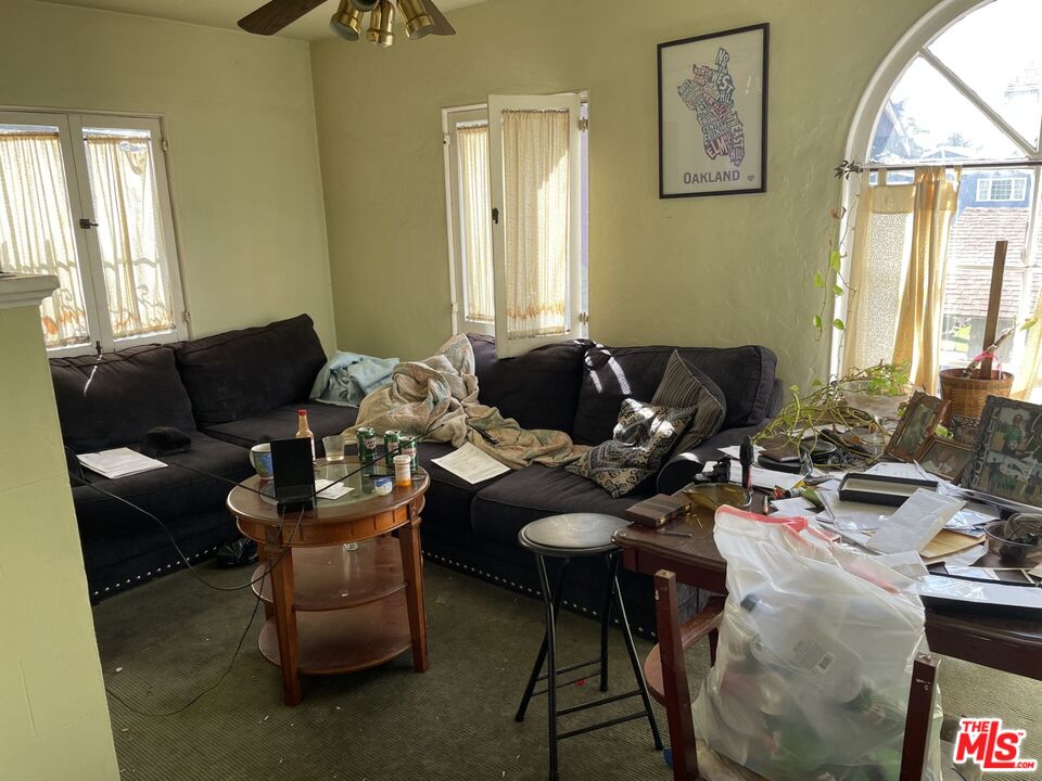 1920 South Rimpau Boulevard Los Angeles, CA 90016 - Photo 16 of 25 a living room with furniture and a window