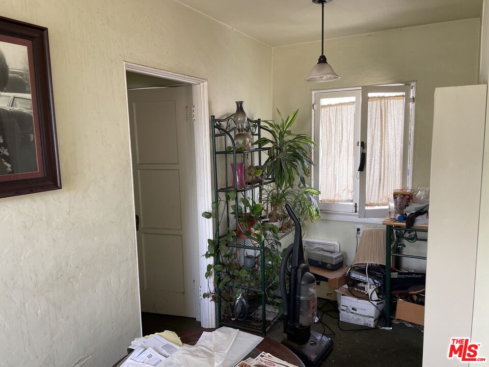 1920 South Rimpau Boulevard Los Angeles, CA 90016 - Photo 17 of 25 a room with window and potted plant
