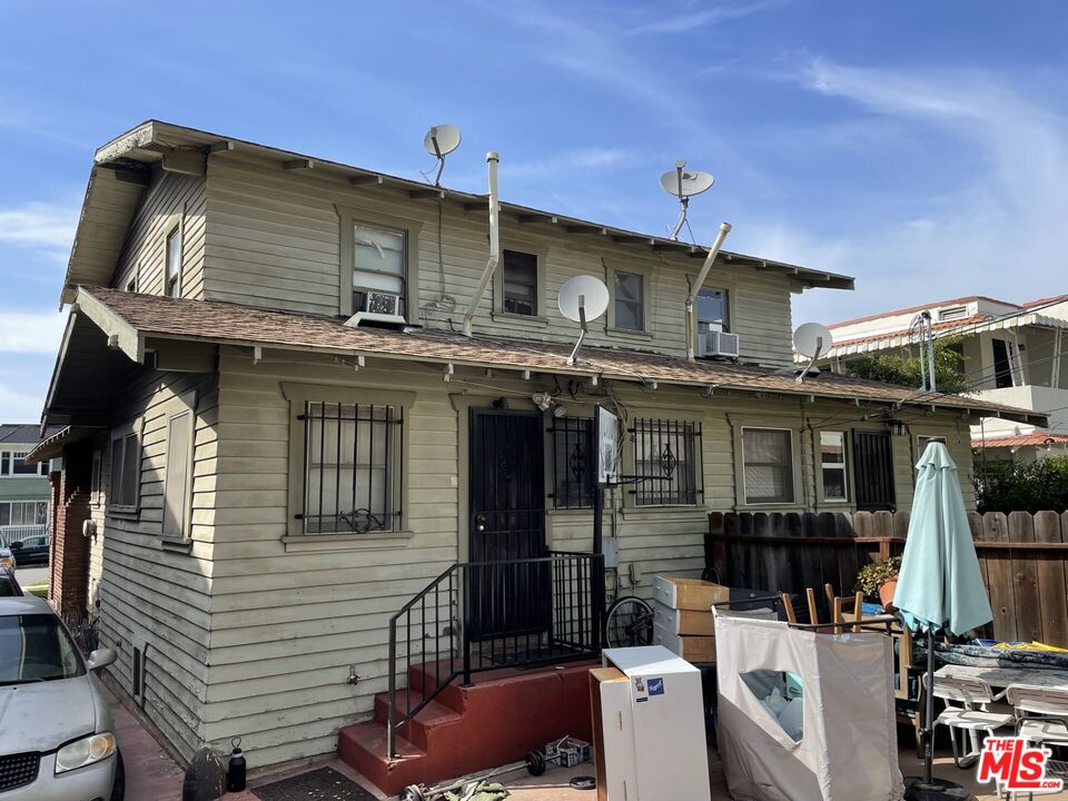 1920 South Rimpau Boulevard Los Angeles, CA 90016 - Photo 23 of 25 a view of a house with a sink and balcony