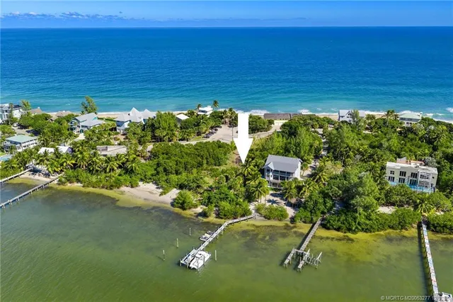 a view of a lake with lawn chairs