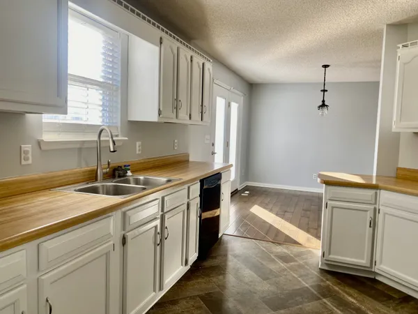 a kitchen with a sink and cabinets