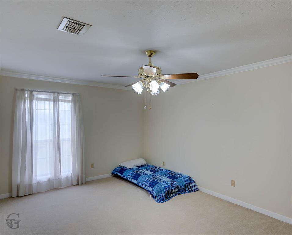 5516 Hickory Ridge Drive Bossier City, LA 71111 - Photo 25 of 33 a room with a chandelier fan and a window