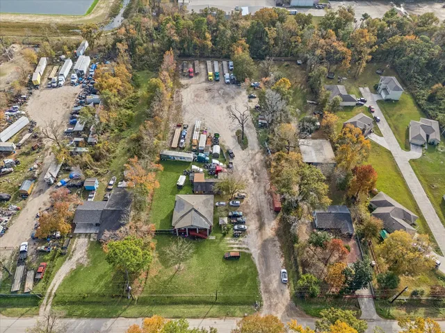 an aerial view of residential houses with outdoor space