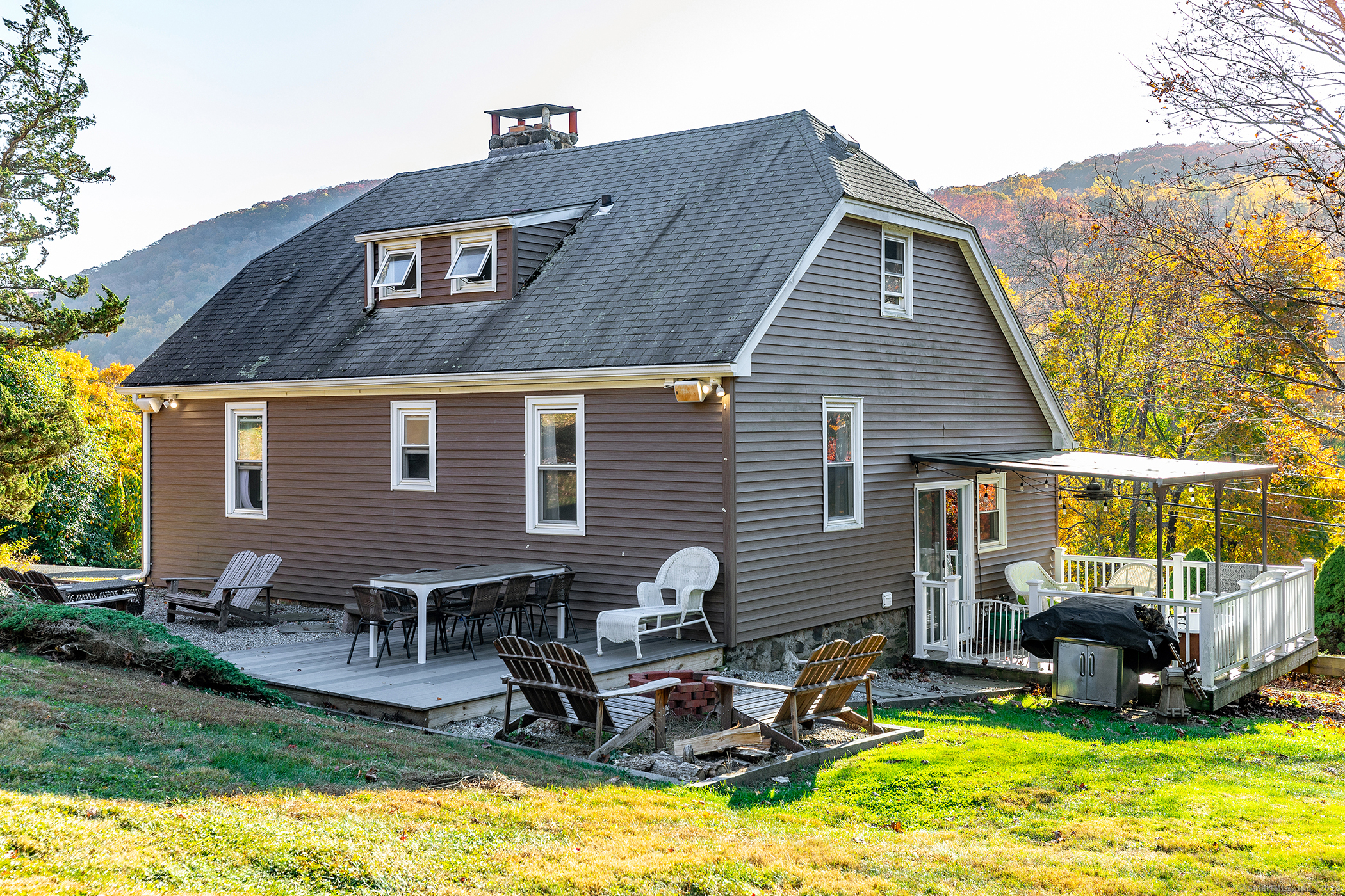 5 Windmill Road New Fairfield, CT 06812 - Photo 27 of 37 a front view of house with yard and outdoor seating