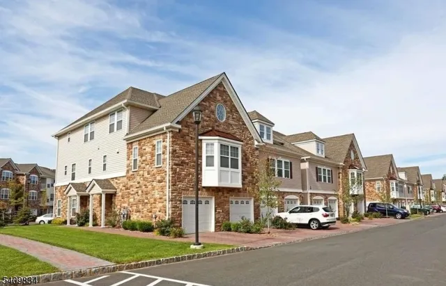 a view of a street with a building in the background