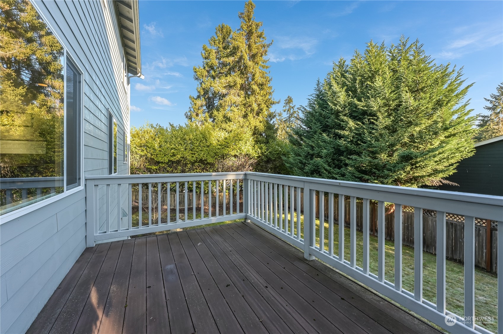 10408 Southeast 13th Street Bellevue, WA 98004 - Photo 12 of 38 a view of balcony with wooden floor and fence