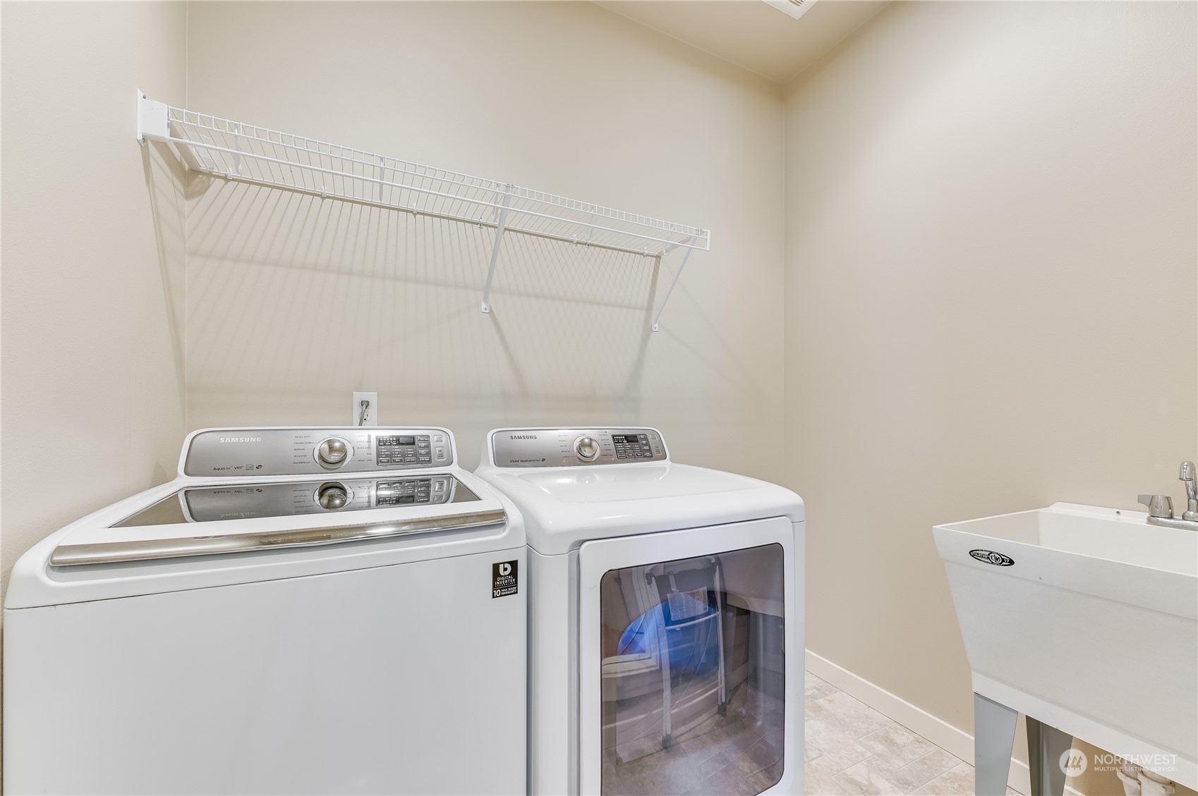 10408 Southeast 13th Street Bellevue, WA 98004 - Photo 15 of 38 a utility room with dryer and washer