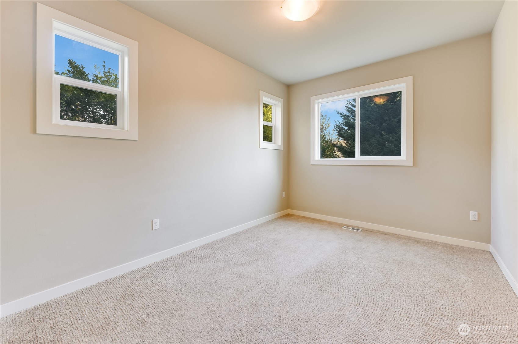10408 Southeast 13th Street Bellevue, WA 98004 - Photo 16 of 38 a view of an empty room with a window