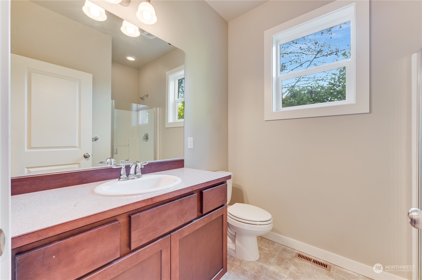 10408 Southeast 13th Street Bellevue, WA 98004 - Photo 17 of 38 a bathroom with a toilet a sink and mirror