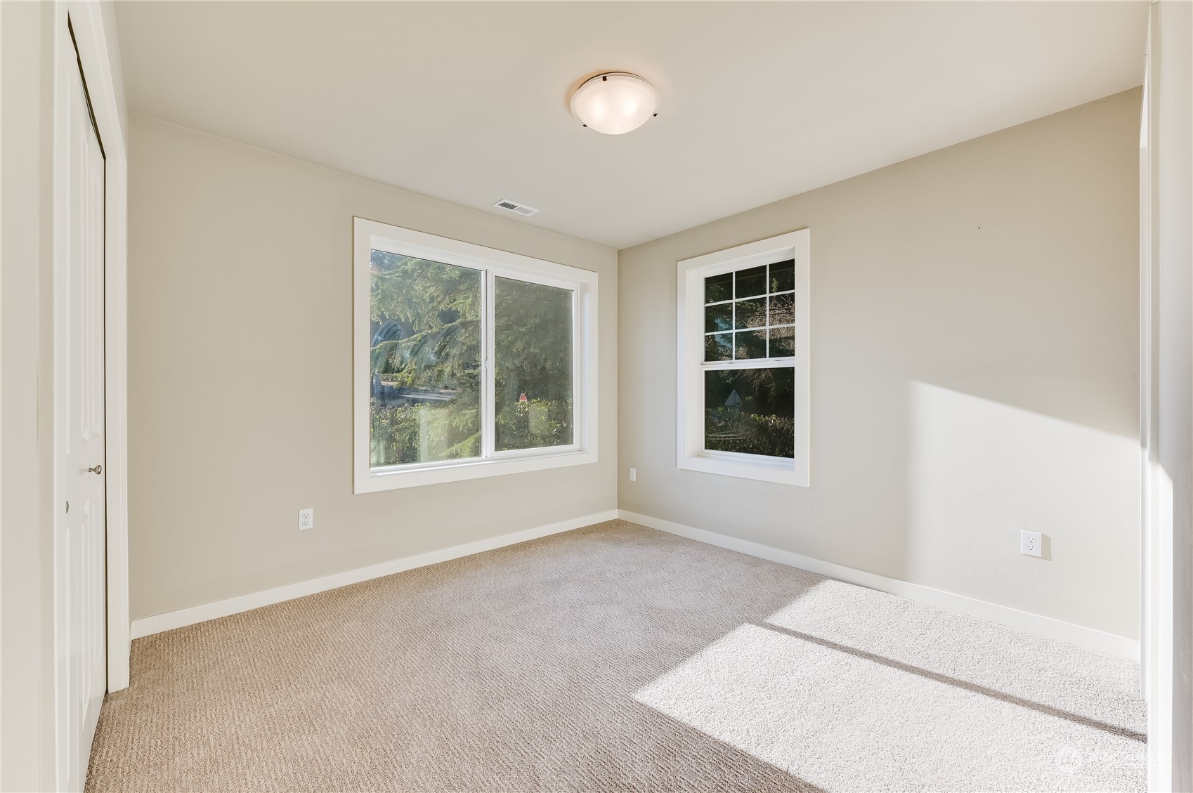 10408 Southeast 13th Street Bellevue, WA 98004 - Photo 19 of 38 a view of an empty room with a window