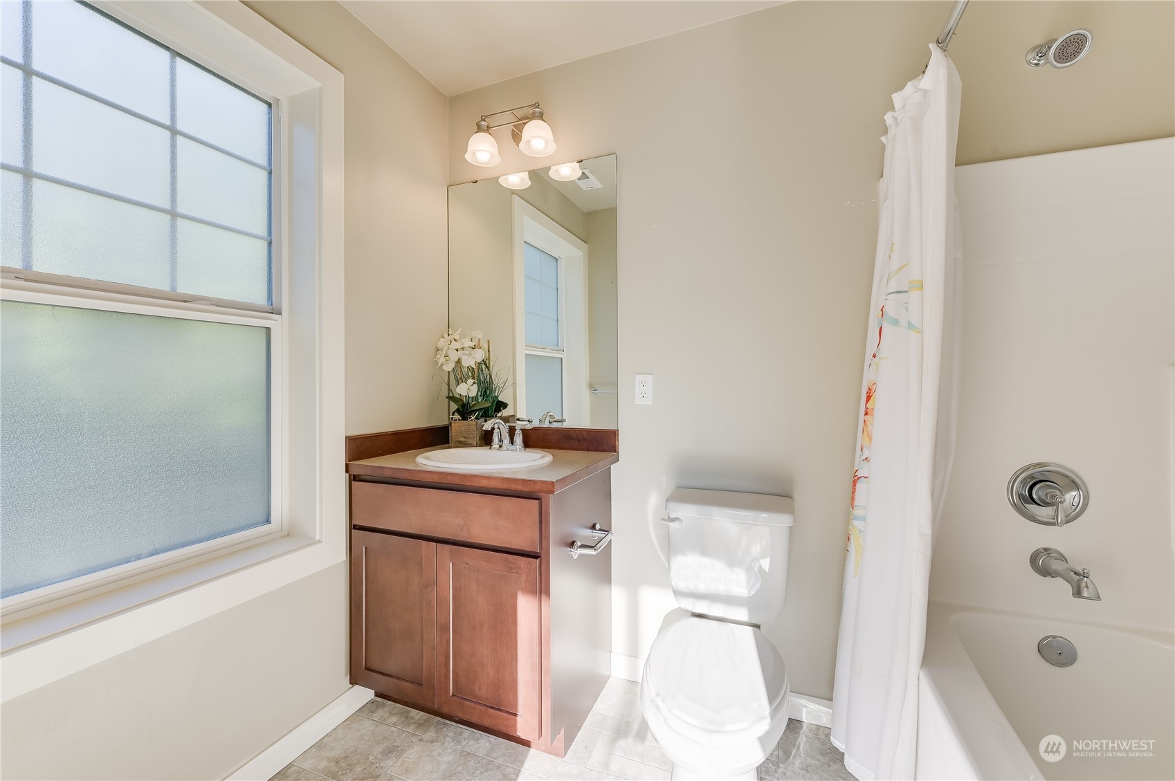 10408 Southeast 13th Street Bellevue, WA 98004 - Photo 20 of 38 a bathroom with a sink a toilet and shower