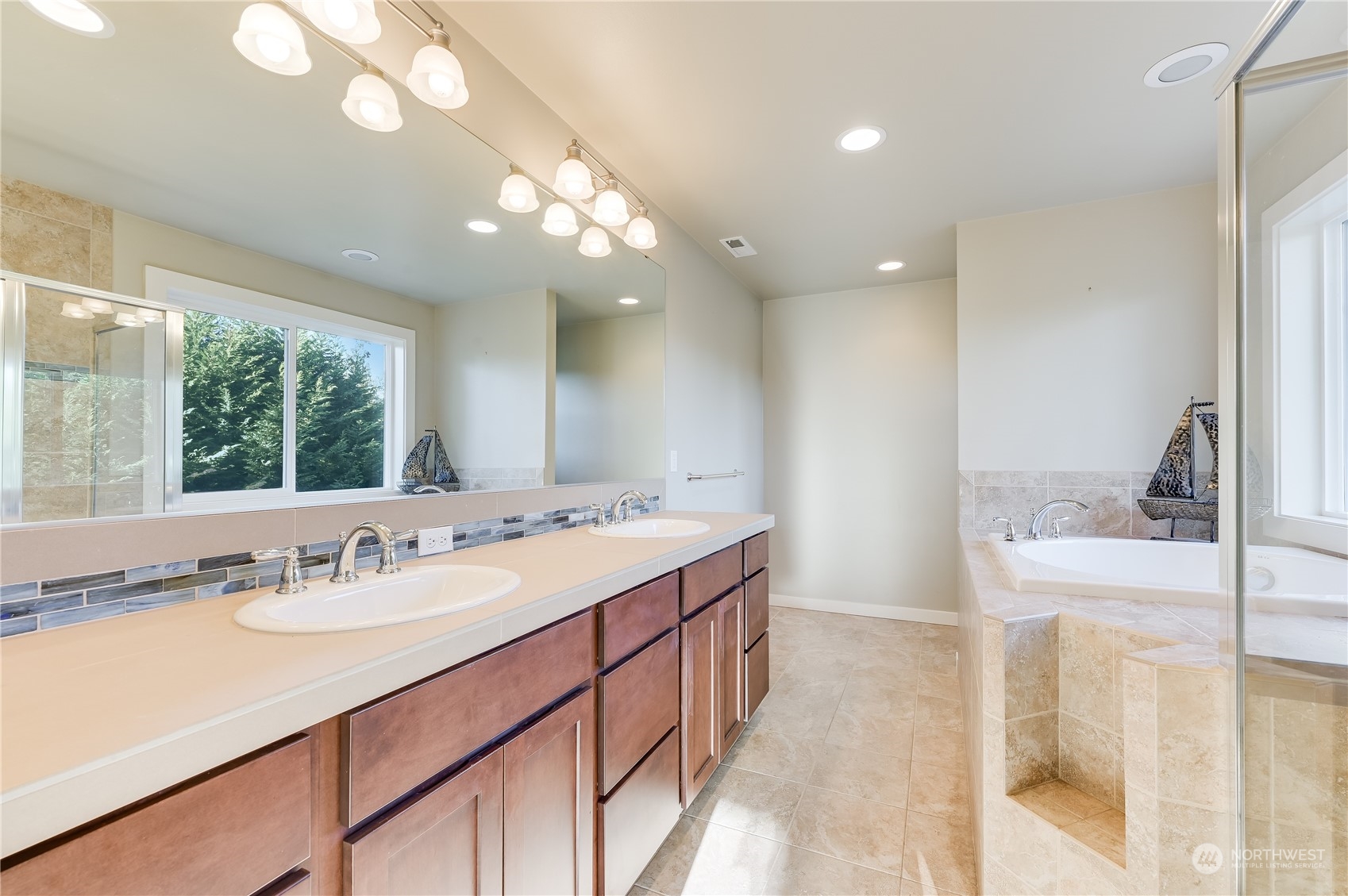 10408 Southeast 13th Street Bellevue, WA 98004 - Photo 23 of 38 a bathroom with a sink double vanity and a mirror