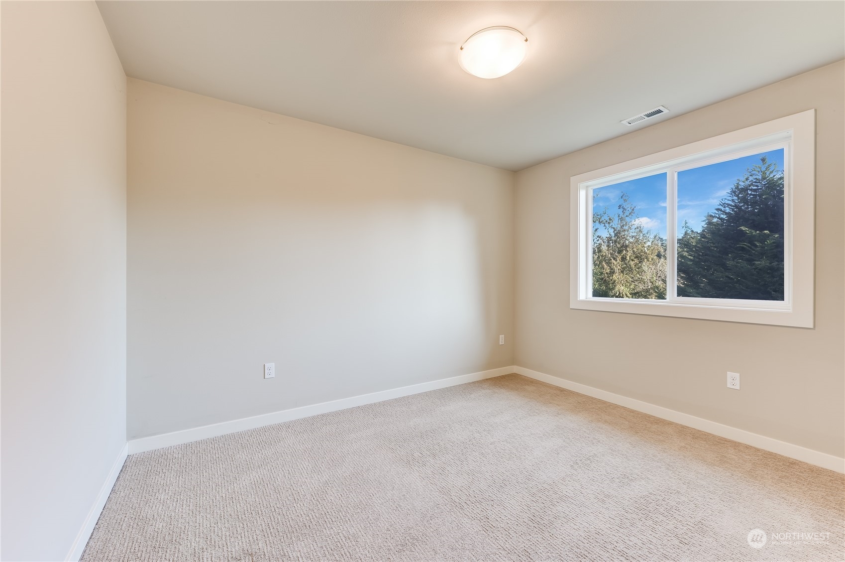 10408 Southeast 13th Street Bellevue, WA 98004 - Photo 29 of 38 an empty room with a window