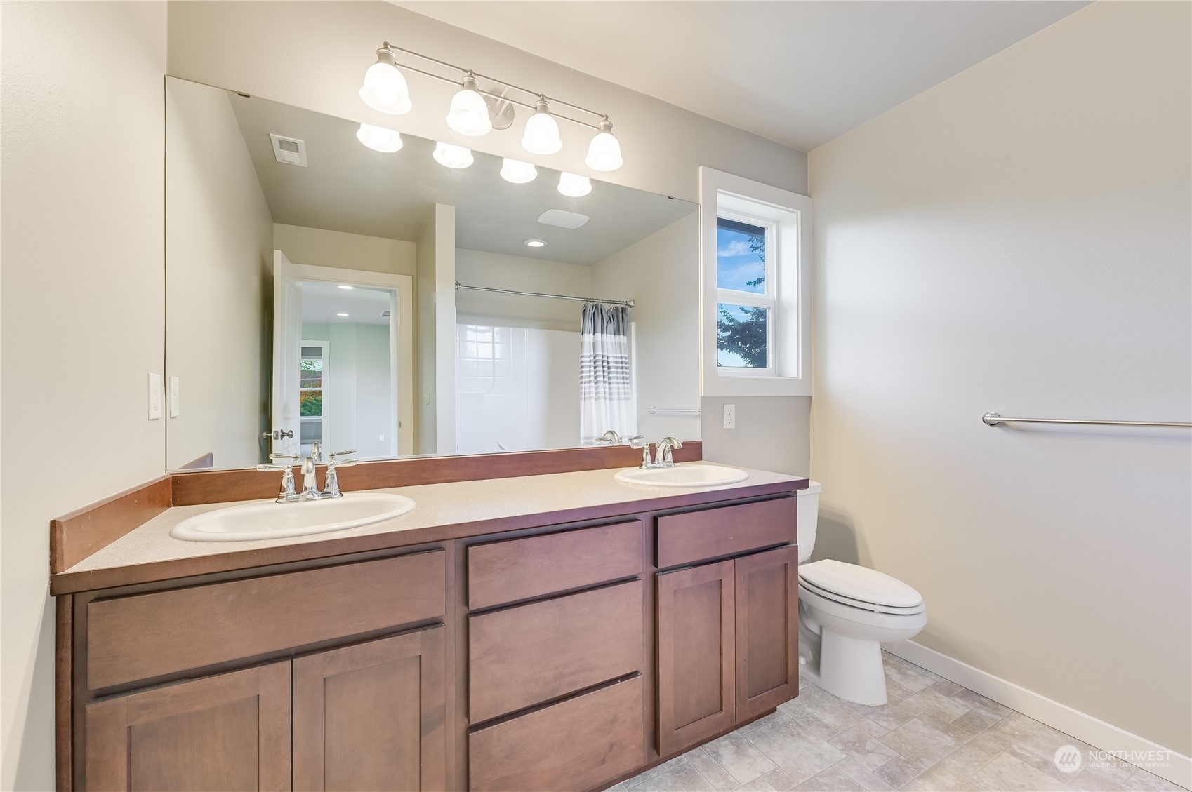 10408 Southeast 13th Street Bellevue, WA 98004 - Photo 30 of 38 a bathroom with a double vanity sink toilet and a mirror