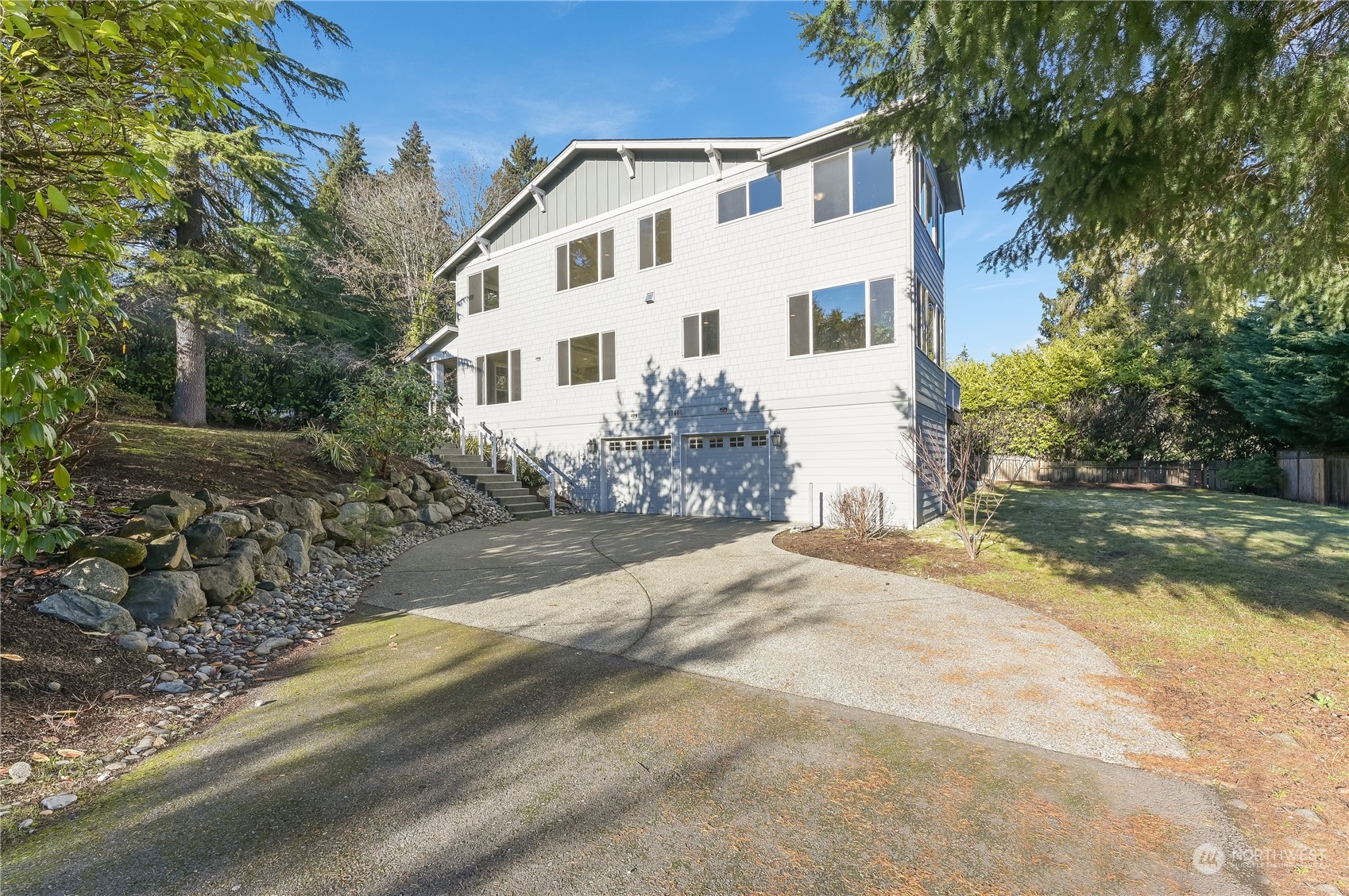 10408 Southeast 13th Street Bellevue, WA 98004 - Photo 34 of 38 a view of a white house with a yard
