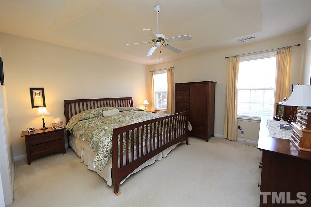 4707 Drewbridge Way Raleigh, NC 27604 - Photo 16 of 28 a bedroom with bed and window