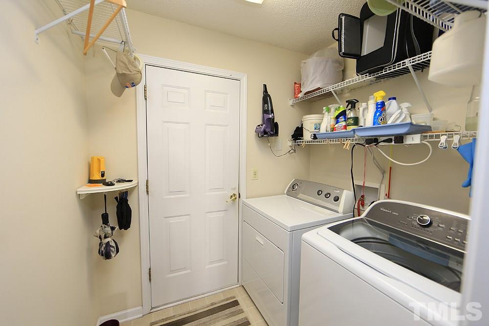 4707 Drewbridge Way Raleigh, NC 27604 - Photo 20 of 28 a view of storage and utility room with washer and dryer