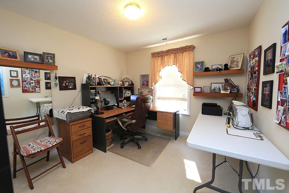 4707 Drewbridge Way Raleigh, NC 27604 - Photo 21 of 28 a view of a workspace with furniture and a window