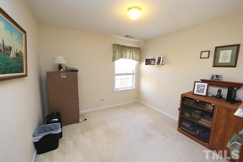 4707 Drewbridge Way Raleigh, NC 27604 - Photo 22 of 28 a room with furniture and window