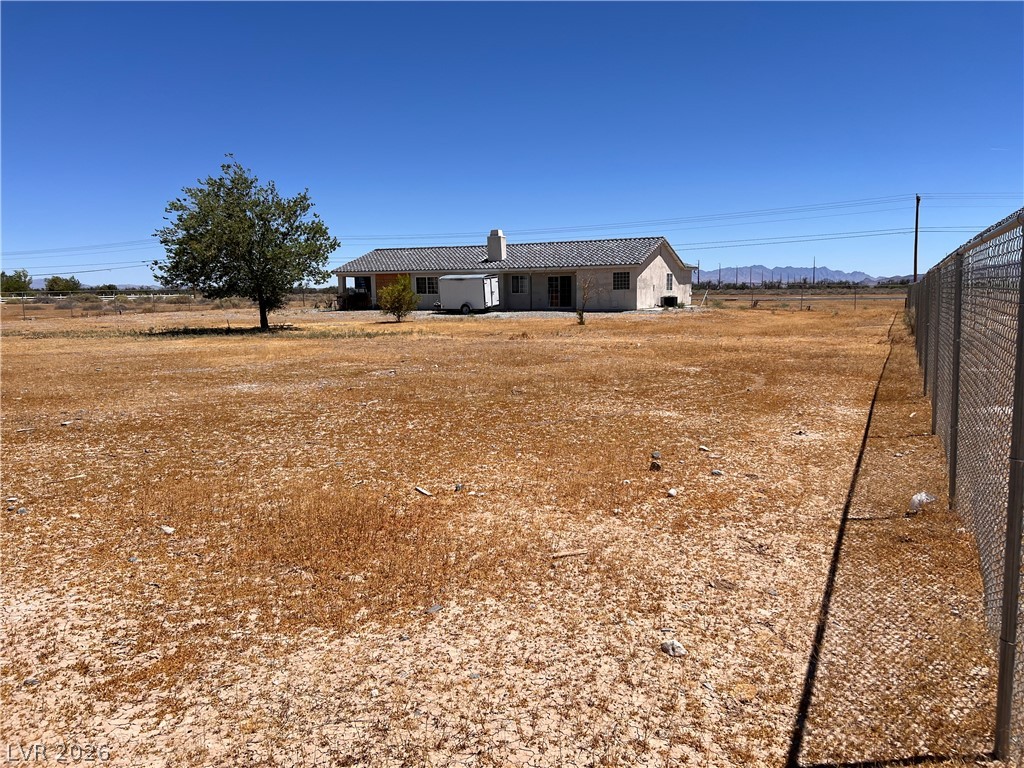 200 East Gamebird Road Pahrump, NV 89048 - Photo 20 of 23 A secluded desert oasis with a single-story home set amidst vast, undeveloped land.