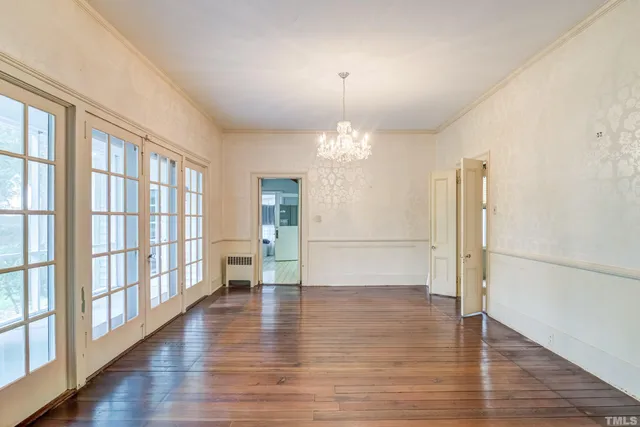 a view of a livingroom with a fireplace and a window