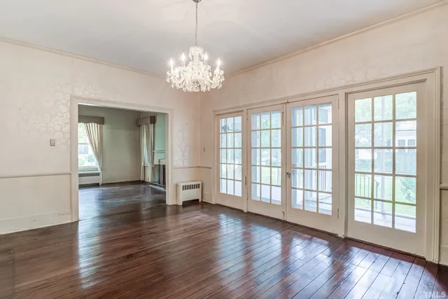 a view of a livingroom with a fireplace and window