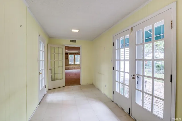 a view of backyard of house with green space