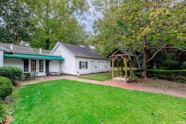 a view of livingroom with furniture wooden floor and windows
