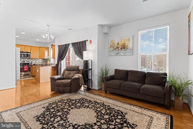 a living room with furniture and a rug