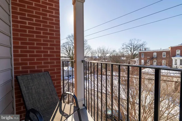 a view of a house with backyard porch and sitting area
