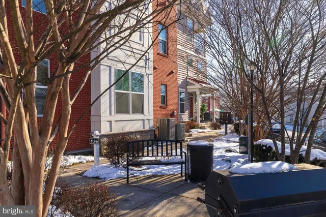 a view of a patio with iron fence