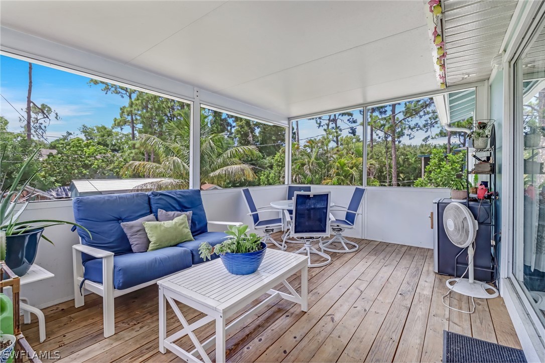 8454 Wren Road Fort Myers, FL 33967 - Photo 18 of 23 a view of a patio with a dining table and chairs