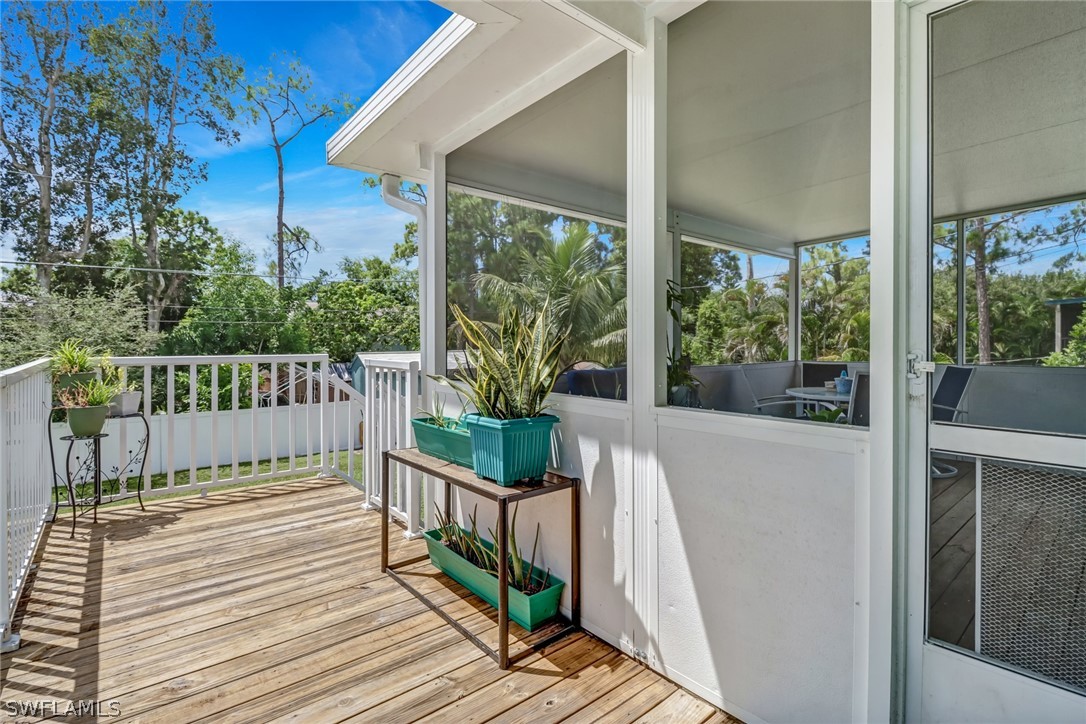 8454 Wren Road Fort Myers, FL 33967 - Photo 19 of 23 a view of a balcony with wooden floor