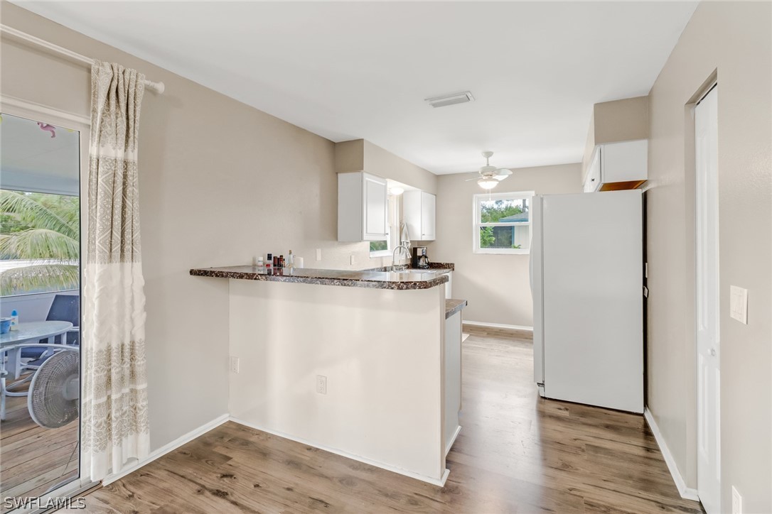 8454 Wren Road Fort Myers, FL 33967 - Photo 6 of 23 a view of kitchen with wooden floor