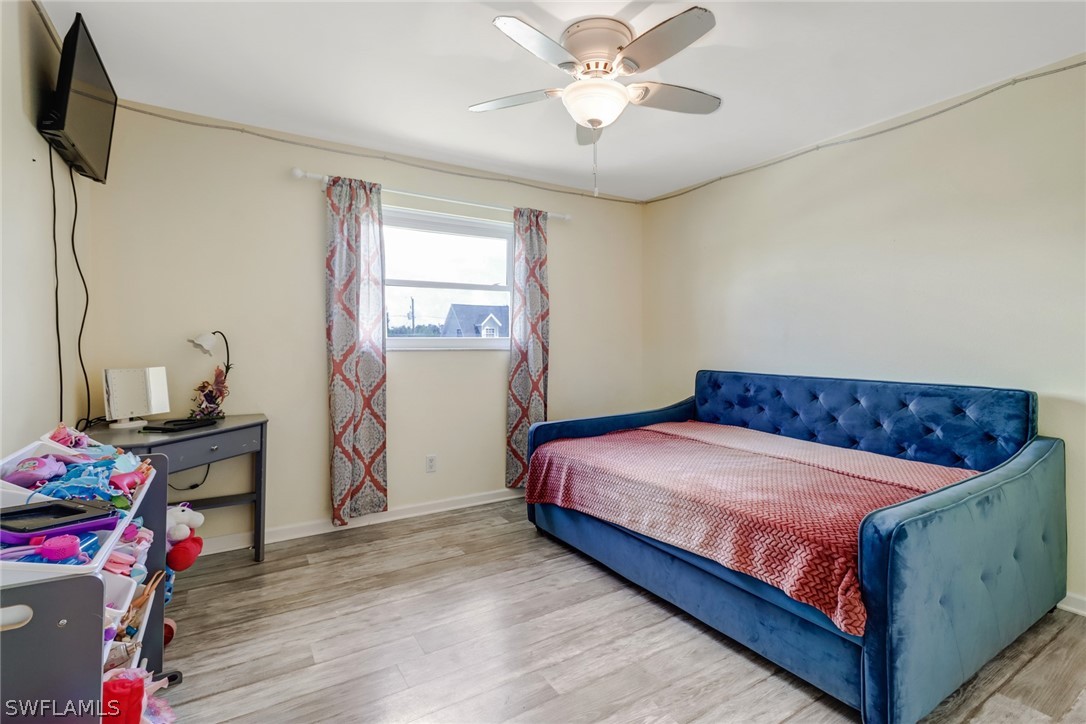 8454 Wren Road Fort Myers, FL 33967 - Photo 9 of 23 a bedroom with a bed and a window