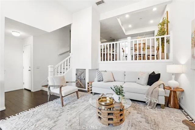 a living room with furniture and a rug