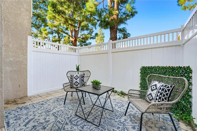 a view of a chairs and table in patio