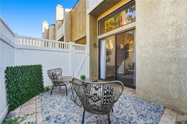 a view of a chair and table in the balcony