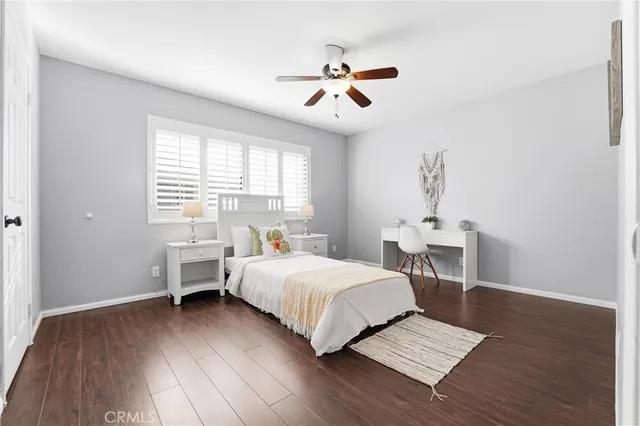 a bedroom with a bed and a table in it