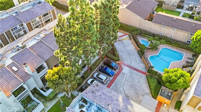 an aerial view of a house with a yard and garden