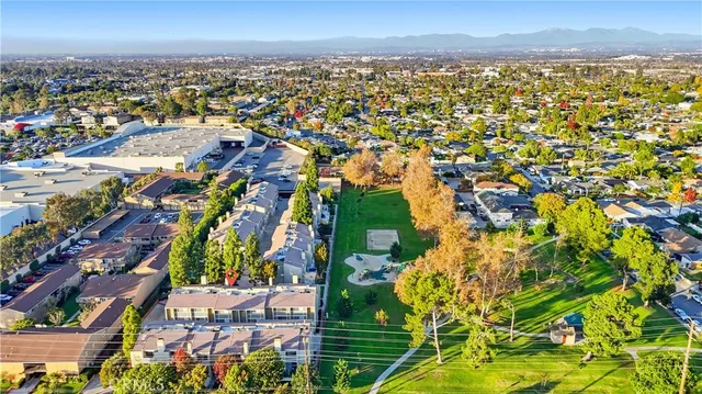 an aerial view of residential building and trees around