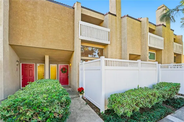 a view of a house with a small yard